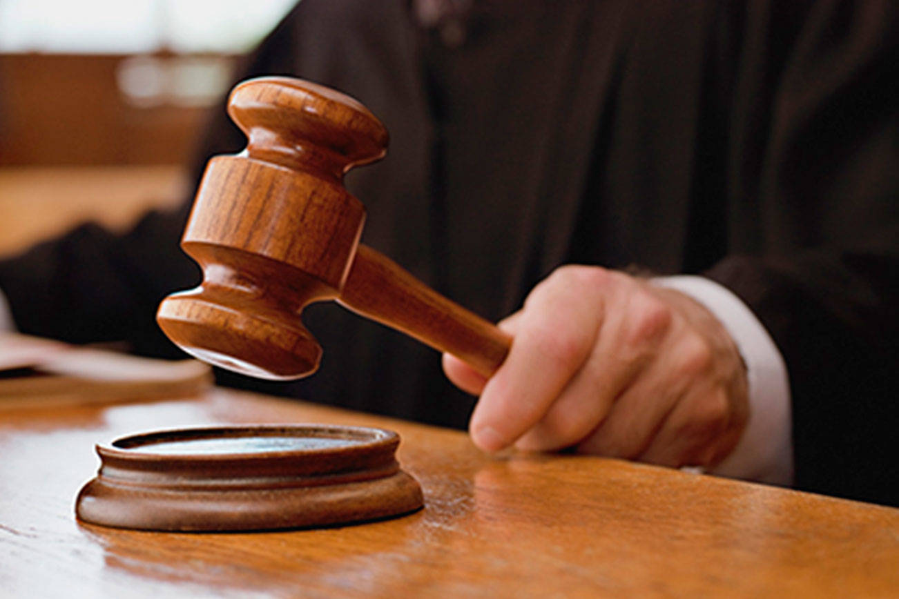 Gavel and Scales of Legal Desk